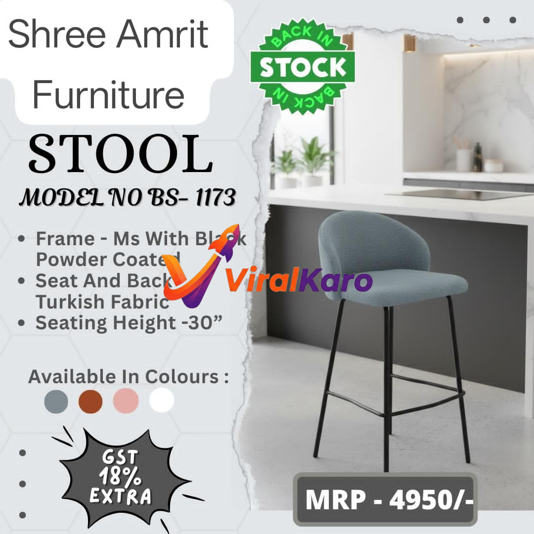 A modern, light blue curved back bar stool from Shree Amrit Furniture, Model BS-1173, with black powder-coated metal legs, shown against a blurred background of a contemporary kitchen island. The image highlights that the product is 'Back In Stock' and details its features: MS frame, Turkish fabric, 30-inch seating height, available colors, and price of MRP 4950/- plus 18% GST extra.