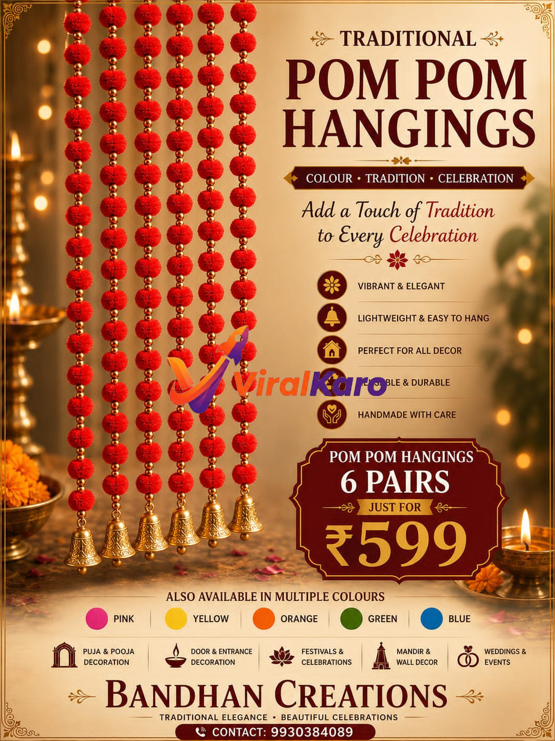 Decorative red pom pom hanging strings with brass bells displayed in a traditional Indian festive setting with lit diyas.