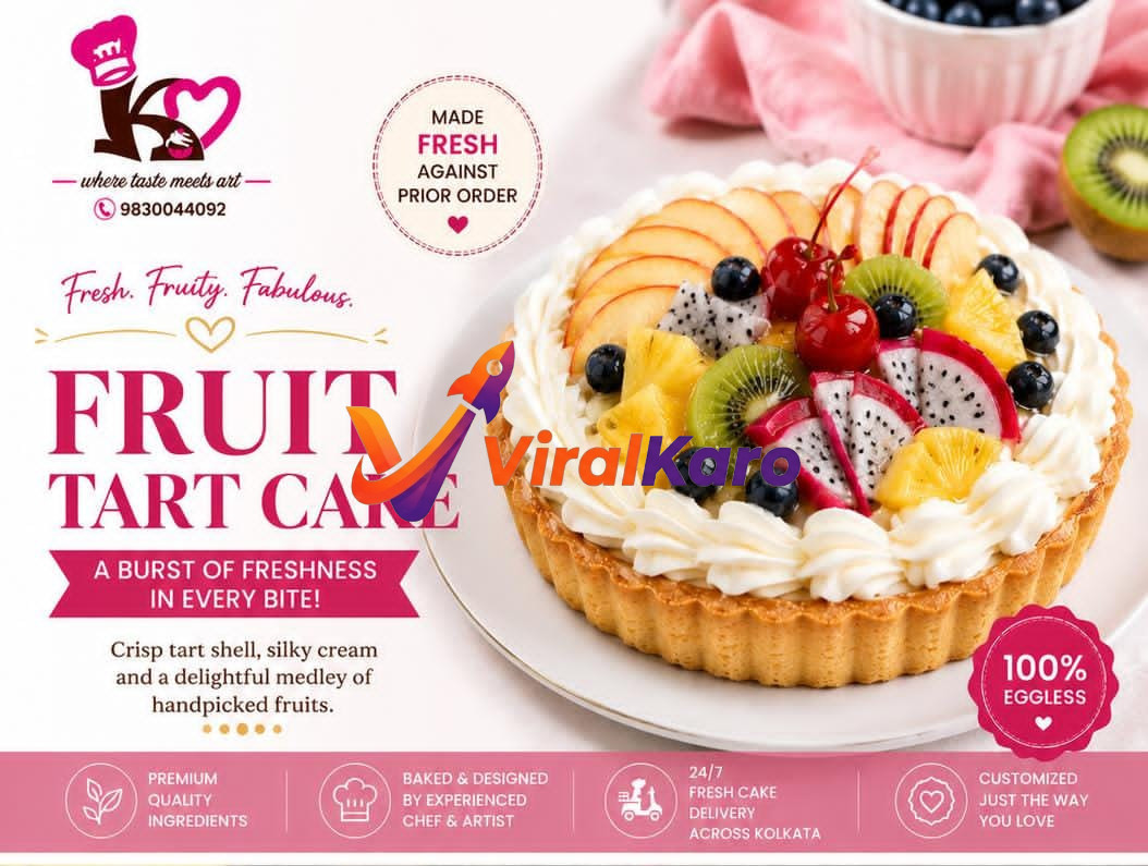 A close-up of a gourmet fruit tart cake topped with sliced kiwi, strawberries, pineapple, and dragon fruit, served on a white plate with cream frosting.